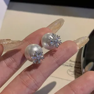 Pearl snowflake stud earrings for women, elegant daily wear micro-pave cubic zirconia jewelry.