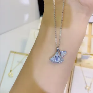 Close-up detail of the sparkling zircon ginkgo leaf pendant necklace, elegant jewelry display.