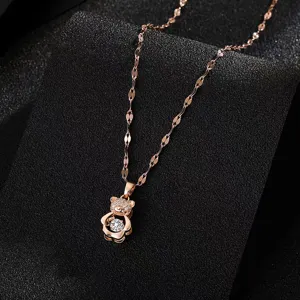 Close-up detail of the rose gold shimmering bear pendant necklace with sparkling micro-pave zirconia.