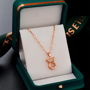 Rose gold dancing zirconia bear necklace main view displayed inside a green jewelry box.
