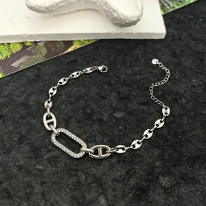 Stainless steel anchor chain bracelet with cubic zirconia oval detail, minimalist silver jewelry.