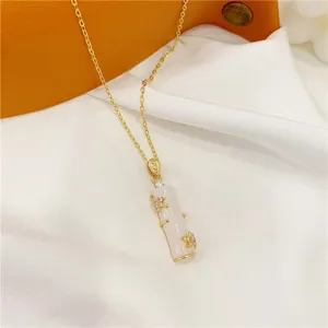 Close-up of elegant chalcedony bamboo pendant necklace detailing fine gemstone accents.