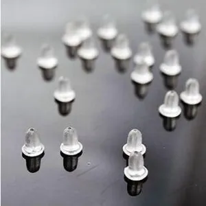 Clear plastic earring backs detail view, secure ear nuts for studs, replacement stoppers.