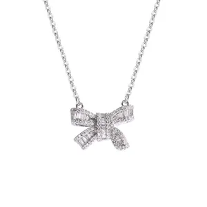 Sparkling baguette cubic zirconia bowknot necklace detail shot, elegant collarbone chain.