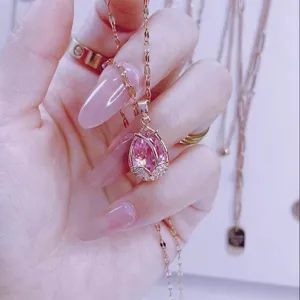 Close-up detail shot of the elegant pink tulip pendant necklace, sparkling rhinestones.