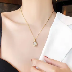Close-up detail view of the elegant tulip pendant necklace, highlighting fine cat's eye stone craftsmanship.