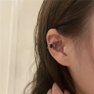 Minimalist C-shaped ear cuff featuring a chic purple zircon stone for non-pierced ears.