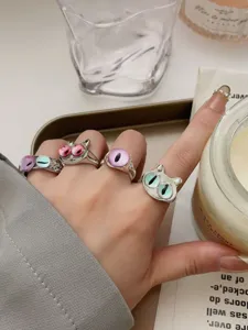Trendy monster eye open rings set for women, unique stackable silver jewelry accessory.