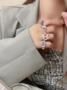 Detail shot of cute and cool monster evil eye open ring set, trendy stacked silver jewelry.