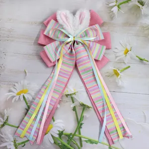 Easter bunny ear bow detail with colorful striped ribbons and plush fabric for spring home decor.