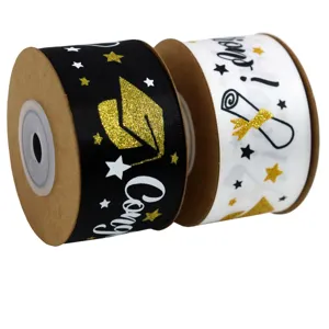 Close-up detail of graduation ribbon with gold glitter cap pattern, perfect for gift wrapping.