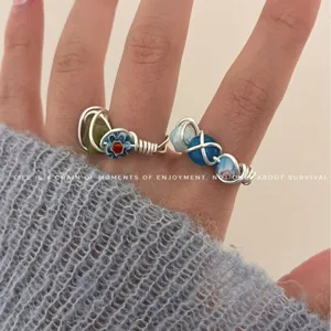 Handcrafted natural stone beaded open stacking rings with wire-wrapped colorful design.