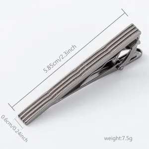 Gunblack metal tie clip with embossed stripes detail, classic business accessory for men.