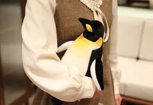 Cute emperor penguin plush toy detail view, soft stuffed animal doll for kids and home decor.