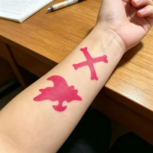 Detail shot of red temporary tattoo sticker and body painting hollow template for party.