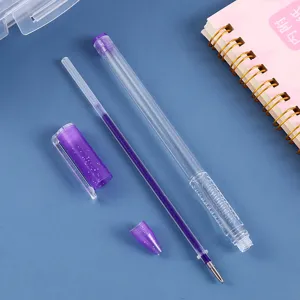 Detailed view of clear glitter gel pen disassembled parts, transparent barrel and refill.