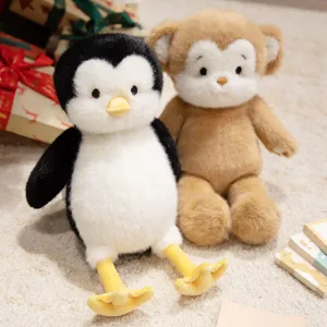 Cute plush toy set featuring a soft stuffed penguin and monkey doll for kids and home decor.
