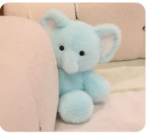 Cute light blue elephant plush toy detail shot, soft and cuddly stuffed animal doll.