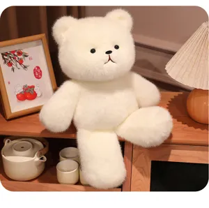 White plush bear toy detail shot, cute stuffed animal doll for kids, soft fluffy fabric home decor.
