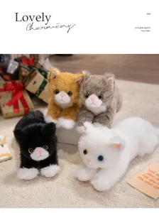 Close-up detail of cute lying plush cat toys set, soft texture, perfect room decor and gift.