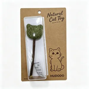 Detail of natural catnip lollipop toy with matatabi wood stick on kraft paper packaging card.
