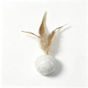 Close up detail of cat toy interactive fluffy plush ball with natural brown feathers.