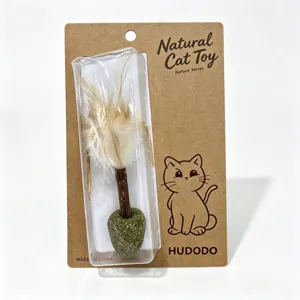 Natural cat toy chew stick with matatabi and feathers in hanging card blister packaging.