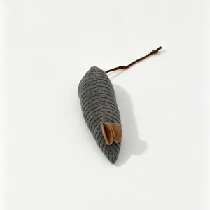 Close-up view of the grey corduroy cat toy mouse showcasing soft texture and brown ears.