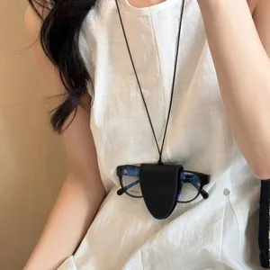 Neck hanging magnetic leather sunglasses clip necklace, portable eyewear storage accessory.