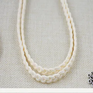 Beige braided waist belt for women, slim double rope design, casual dress accessory.