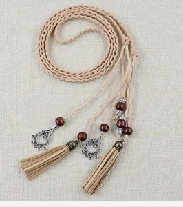 Boho braided waist belt with wooden beads and tassels, delicate ethnic dress accessory.