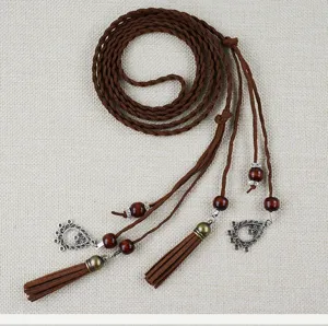 Boho braided waist belt detail, brown faux suede cord with wooden beads and elegant tassels.