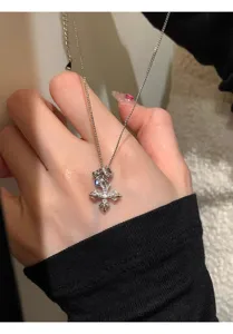 Closeup of silver dorje cross pendant necklace detail, sweet cool style clavicle chain.