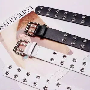 Punk style double grommet belt featuring metal eyelets and durable leather. Perfect for jeans.