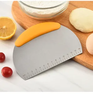 Stainless steel dough scraper with scale and orange handle, perfect for baking bread and pastry.