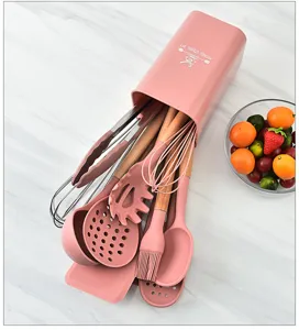 Pink silicone kitchen utensil set with wooden handles, heat resistant cooking tools and holder.
