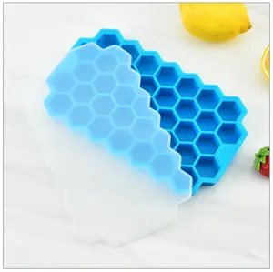 Silicone honeycomb ice cube tray with lid, flexible mold for drinks and cocktail cooling.