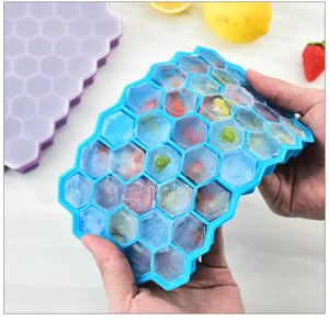 Silicone honeycomb ice cube tray with lid, flexible mold for easy ice release at home.