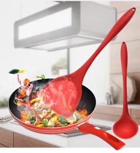 Red silicone kitchen utensil set, solid spatula and soup spoon for cooking, heat resistant.