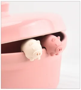 Silicone pot lid lifter anti spill cute pig design kitchen gadget tool for soup boiling.