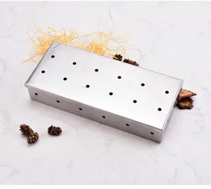 Stainless steel BBQ smoker box with multiple holes for wood chips, ideal for outdoor grilling.