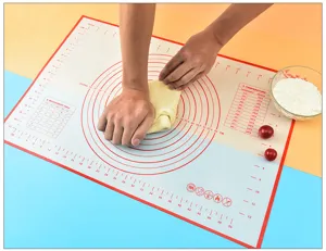 Silicone baking mat with measurement scales and temperature conversion chart for pastry dough.