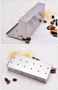 Stainless steel BBQ smoker box detail showing multi-hole design and open structure.