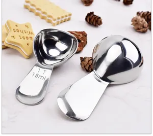 Stainless steel measuring spoon set detail showing clear scale marks for baking and cooking use.