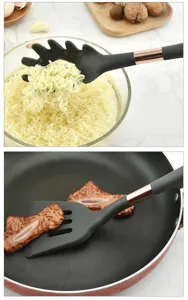 Silicone kitchen utensils set featuring heat-resistant pasta server and slotted turner for cooking.