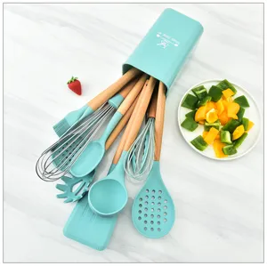 Silicone kitchen utensil set with wooden handles, including spatula, spoon, whisk and storage holder.