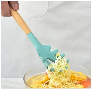 Detail shot of teal silicone pasta spoon with wooden handle scooping noodles from bowl.