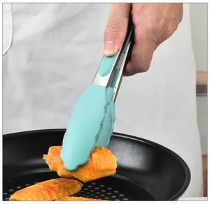 Stainless steel kitchen food tong with heat-resistant silicone grip for cooking detail view.