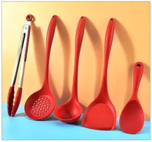 Close-up of vibrant red silicone kitchen utensils set with heat-resistant materials for daily cooking.