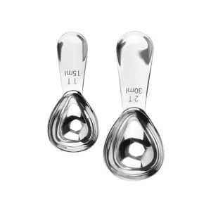 Stainless steel measuring spoon set of two with engraved capacity scales for baking and coffee.